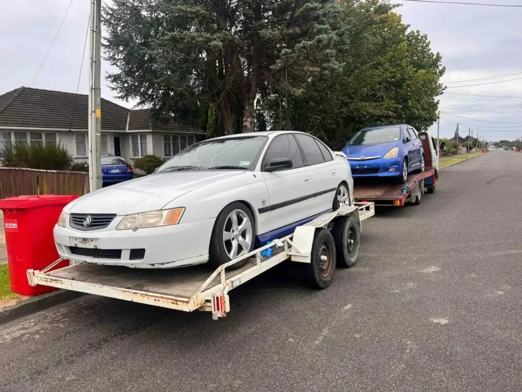 Scrap car in Trentham, Upper Hutt, being towed as part of a fast, free vehicle removal service for local customers